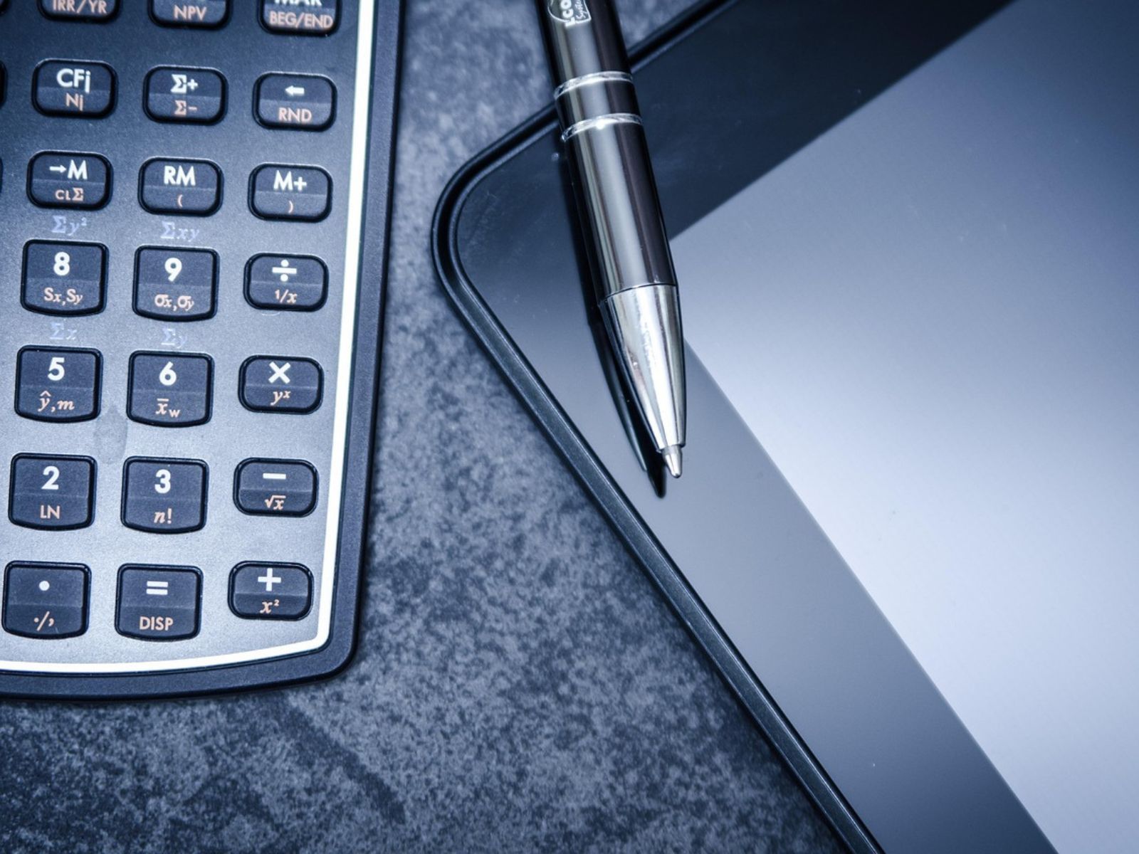 calculator pen tablet taxes finances financial tax